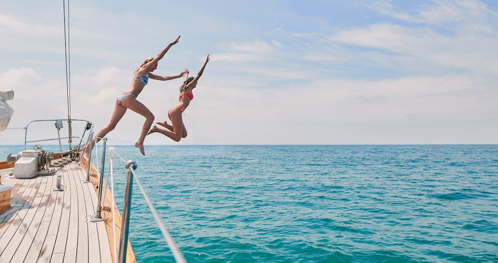 girls-jumping-off-boat